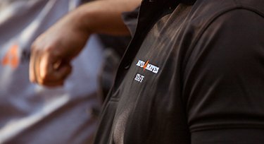 Mates4Mates logo on a black shirt. 
