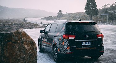 Mates4Mates van parked in the snow in Tasmania, Australia. 