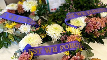ANZAC Day wreaths lying on a table.